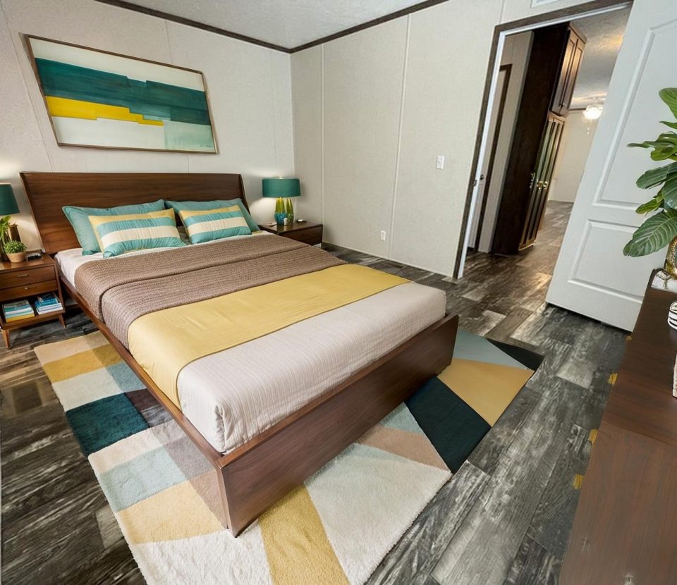 A modern bedroom with a wooden bed, striped bedding in green, yellow, and beige tones, two nightstands with lamps, geometric rug, abstract wall art, potted plant, dresser, and an open door to a hallway.